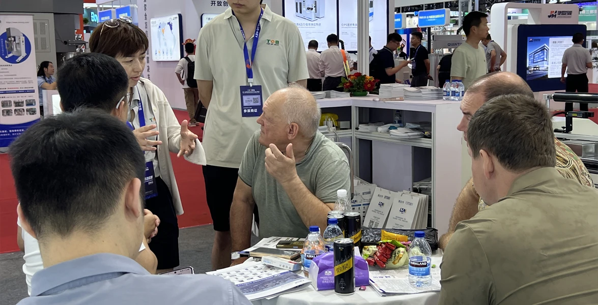 TOB NEW ENERGY Marketing Director Amy Wang in technical discussion with international clients at CIBF2026 TOB NEW ENERGY Marketing Director Amy Wang discuss battery manufacturing solutions with clients at CIBF2026